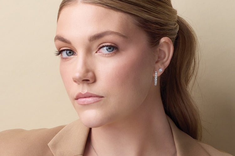 Model wearing lab-grown diamond earrings