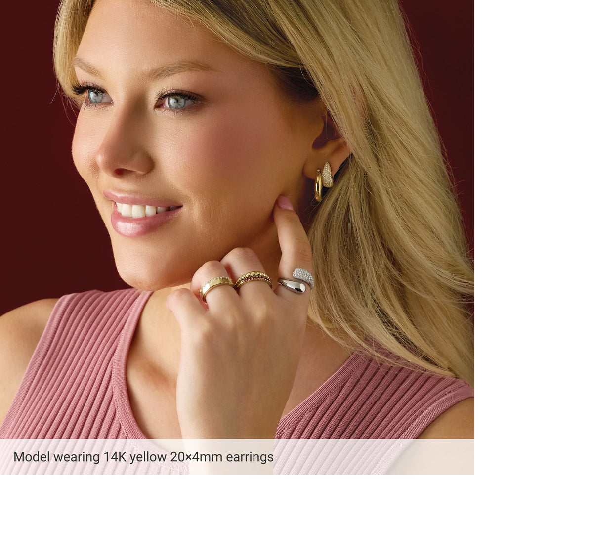 Model wearing 14K gold hoop earrings, side view